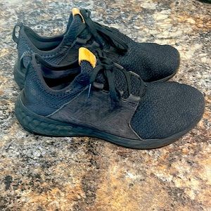 Black New Balance running shoes with gum bottom. Worn a couple dozen times
